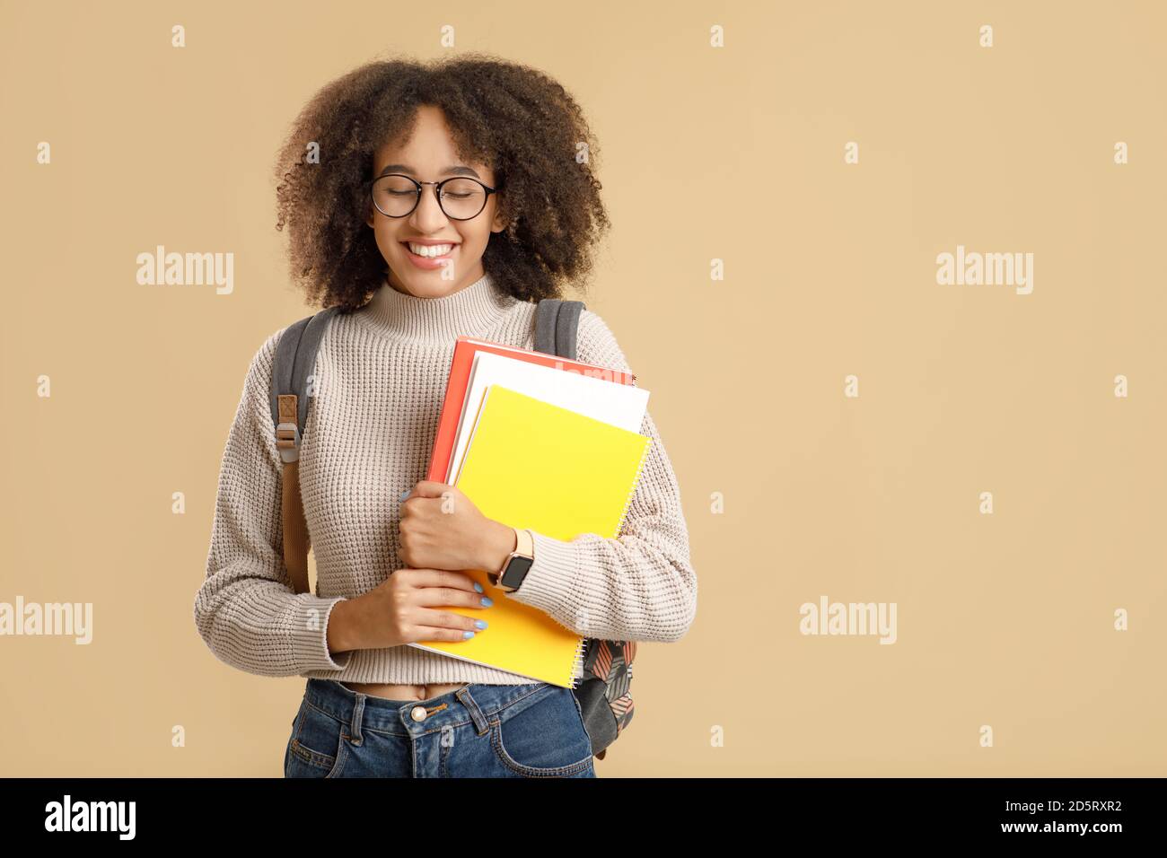 Natural human emotions of shame and shyness. Funny african american millennial woman in glasses Stock Photo