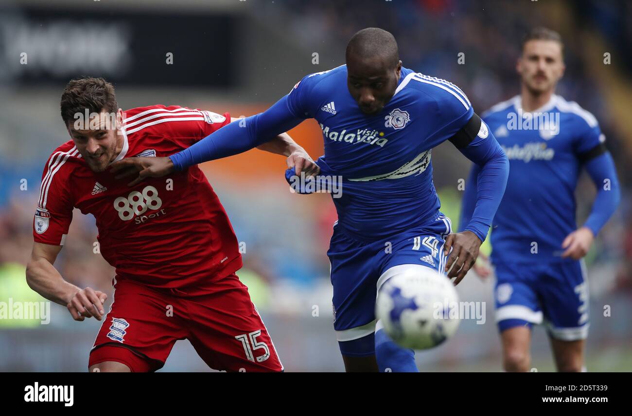Birmingham City's Lukas Jutkiewicz (left) tussles for the ball with Cardiff City's Sol Bamba  Stock Photo
