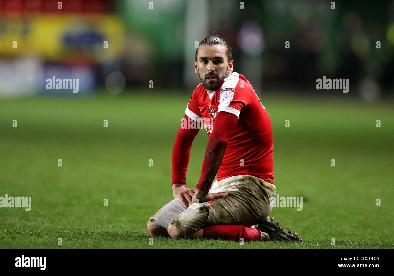 Charlton Athletic's Ricky Holmes sits and looks up after a heavy tackle Stock Photo