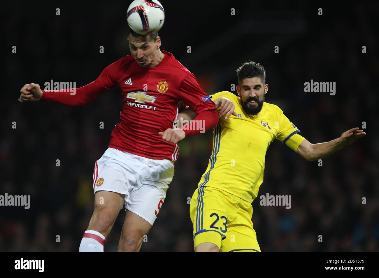Manchester United's Zlatan Ibrahimovic (left) and FC Rostov's Miha Mevlja battle for the ball in the air  Stock Photo