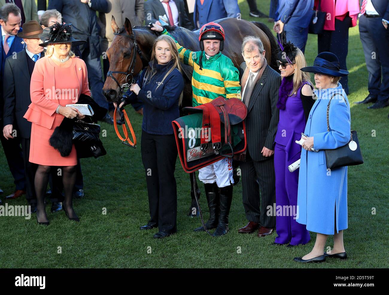 Jockey JJ Codd with Cause Of Causes and owner J.P. McManus (third right) and after winning the Glenfarclas Chase during Ladies Day of the 2017 Cheltenham Festival Stock Photo