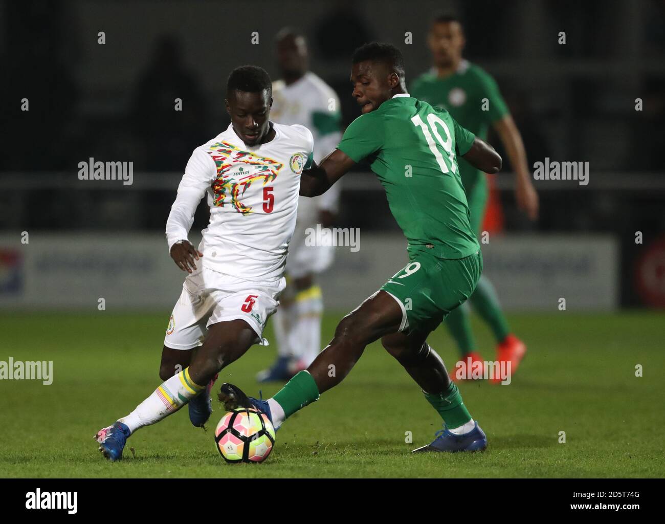 Senegal's Idrissa Gana Gueye battles for possession of the ball with Nigeria's John Ogu Stock Photo