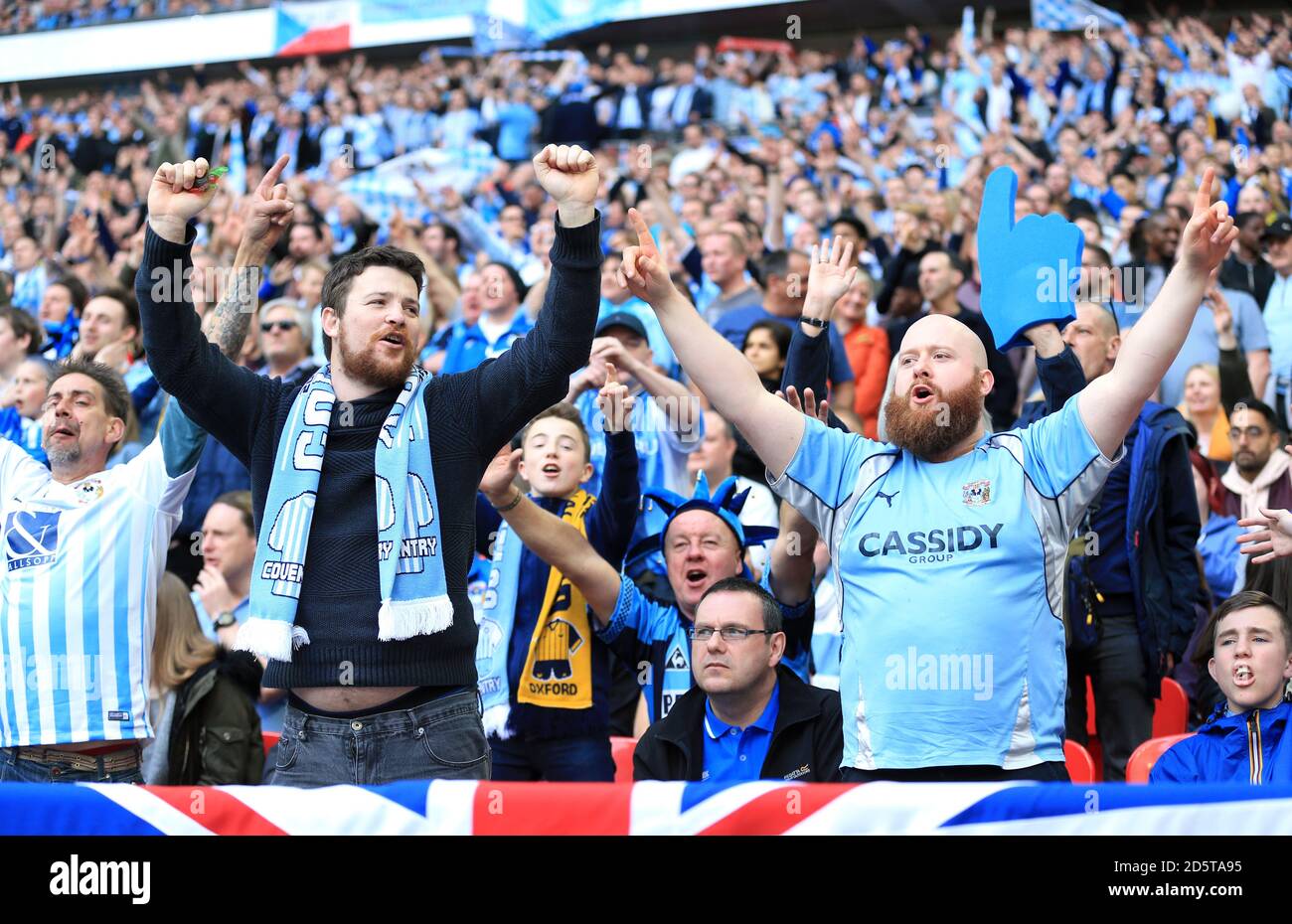 Coventry City fans celebrate in the stands Stock Photo - Alamy