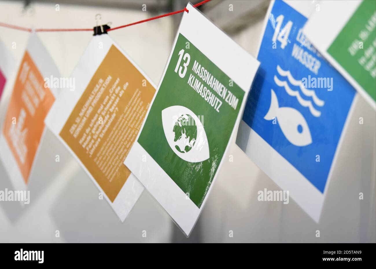 Berlin, Germany. 14th Oct, 2020. Signs such as 'Measures for climate protection' with goals for sustainable development are hung up at the Citizen Science Festival 'Mitforschen!' in the Berlin Kulturbrauerei as part of 'Bürger schaffen Wissen'. The event will take place on 14 and 15 October 2020. The festival is about sustainable development. The festival offers projects the opportunity to introduce themselves and invite people to participate in research. Credit: Kira Hofmann/dpa-Zentralbild/ZB/dpa/Alamy Live News Stock Photo