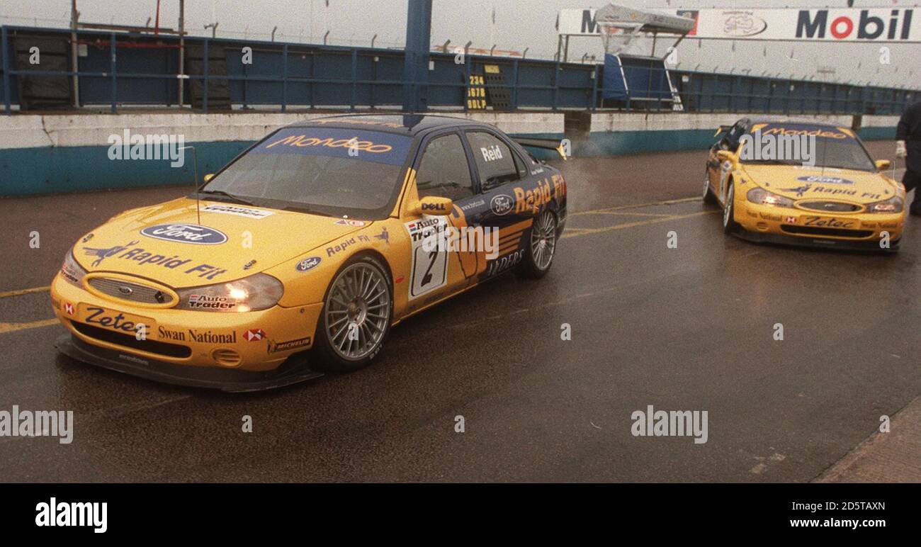 Ford Mondeo driver Anthony Reid leads his team-mate Alain Menu out for practice for the opening round of the British Touring Car Championship at Donington Park Stock Photo