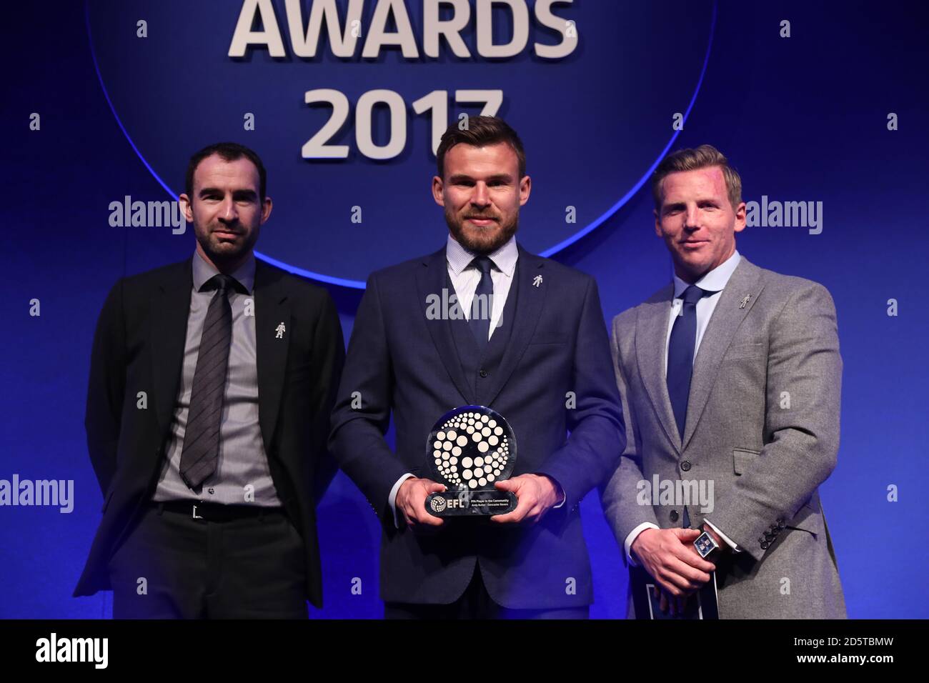 Doncaster Rover's Andy Butler (centre) collects the PFA Player in the ...