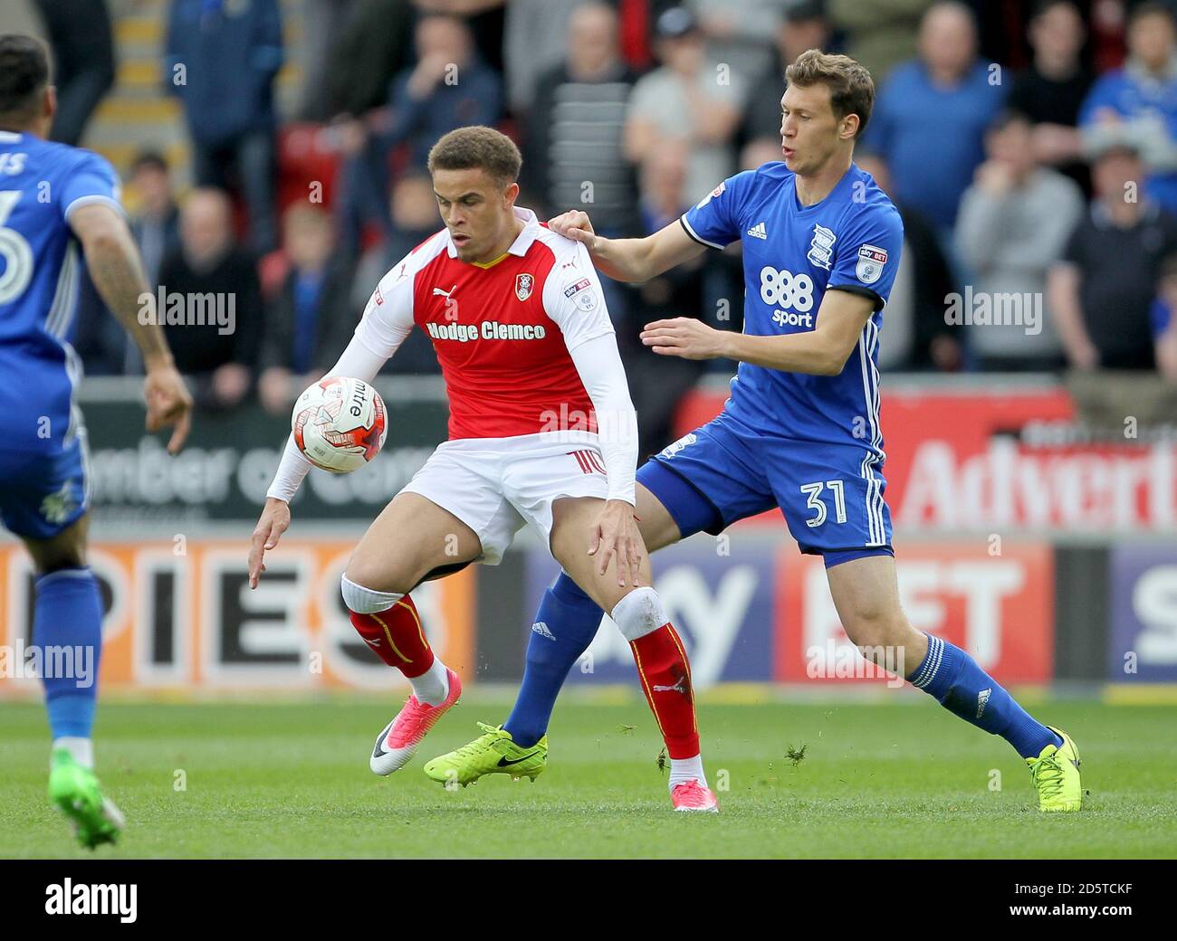 Rotherham United's Carlton Morris and Birmingham City's Krystian Bielik challenge Stock Photo