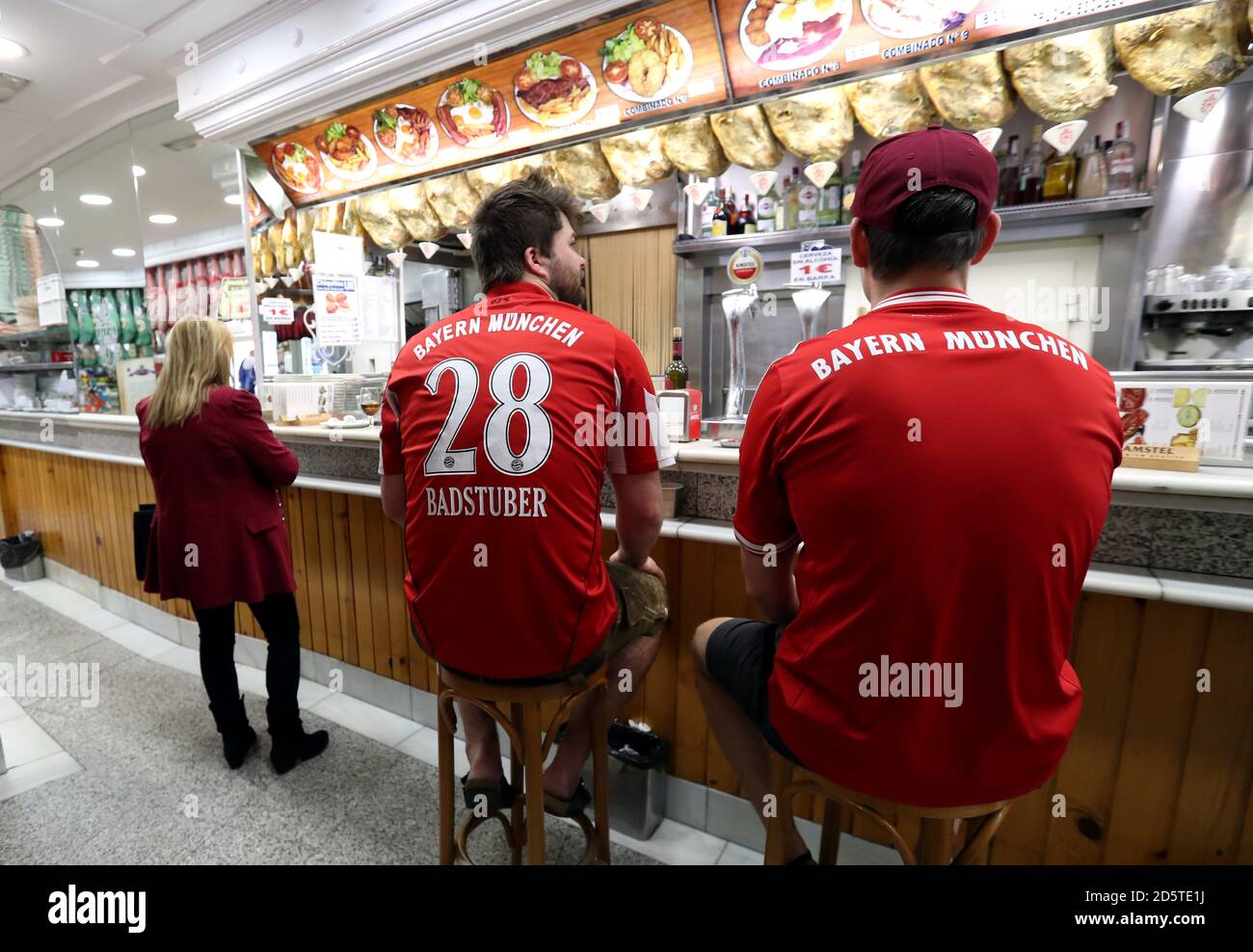 Bayern Munich fans wait for food in the city ahead of the game Stock Photo