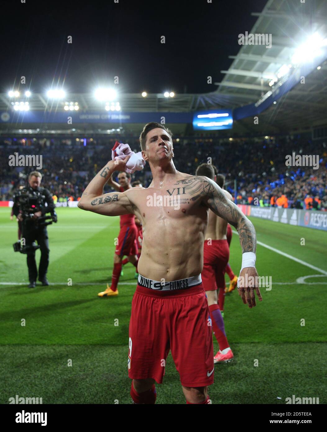 Atletico Madrid's Fernando Torres throws his shirt in the crowd after the final whistle Stock 