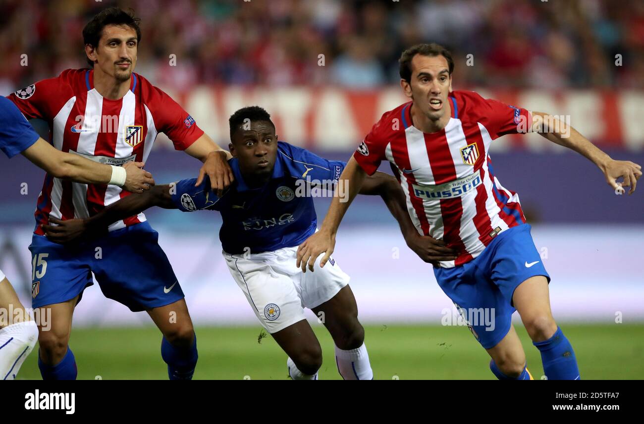 Atletico Madrid's Diego Godin (right) and Stefan Savic battle for the ball with Leicester City's Wilfred Ndidi Stock Photo