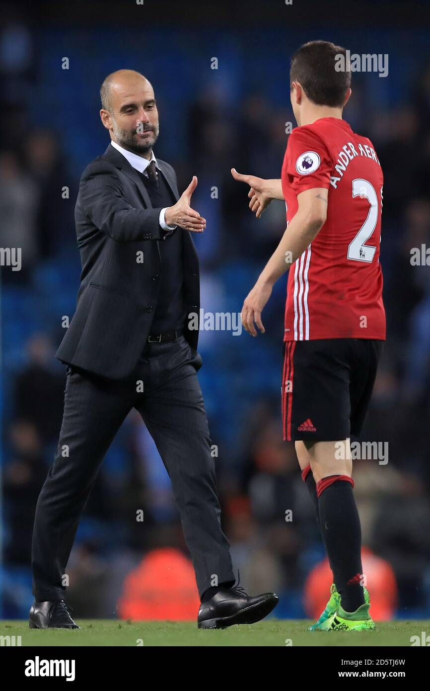 Manchester City manager Pep Guardiola (left) shakes the hand of Manchester  United's Ander Herrera after the final whistle Stock Photo - Alamy
