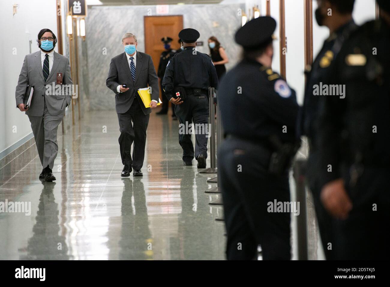 U.S. Senator Lindsey Graham (R-SC) arrives on Capitol Hill for the third day of Senate Judiciary Committee hearings considering the nomination of Judge Amy Coney Barrett to become Associate Justice of the U.S. Supreme Court in Washington, DC, on October 14, 2020, amid the coronavirus pandemic. The committee hearings are expected to last four days, and if confirmed, Barrett would replace Justice Ruth Bader Ginsburg to become President Trump's third nominee to be confirmed to the Court. (Graeme Sloan/Sipa USA) (Graeme Sloan/Sipa USA) Stock Photo