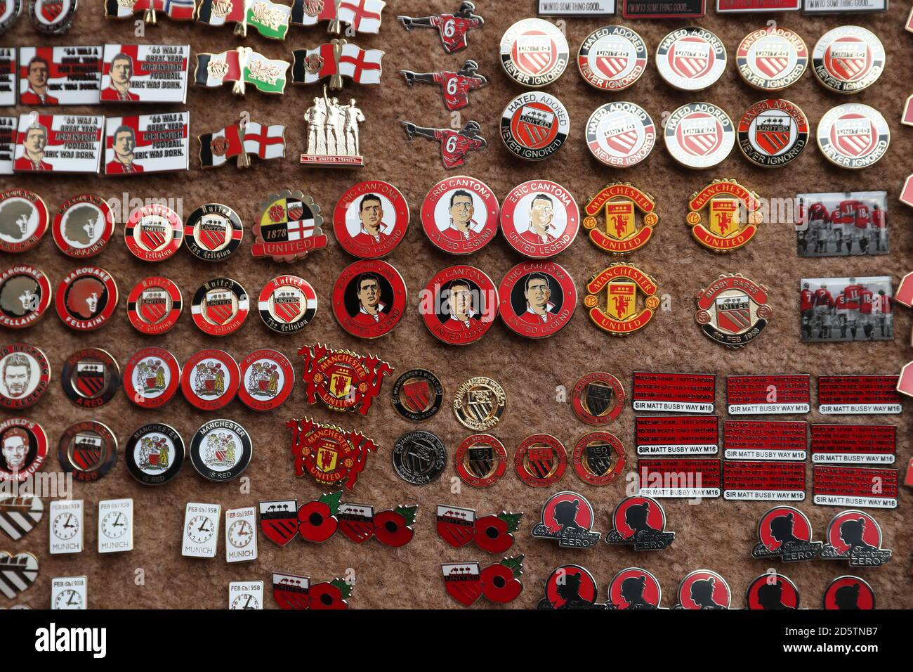 Manchester United pin badges on sale outside Old Trafford before the game  Stock Photo - Alamy