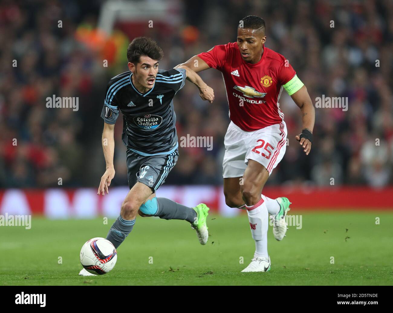 Celta Vigo's Jozabed (left) and Manchester United's Luis Antonio Valencia in action Stock Photo