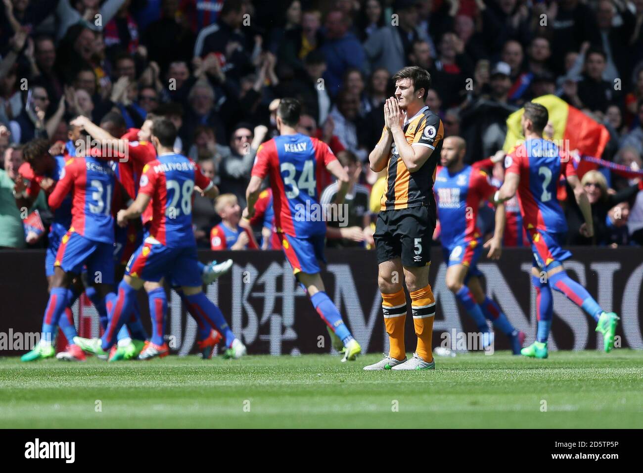 Hullâ€™s Harry Maguire looks dejected after Crystal Palaceâ€™s Wilfried Zaha scored a goal Stock Photo