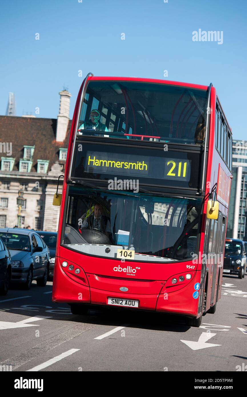 Red double decker bus travelling to Hammersmith in the centre of London, England. Stock Photo
