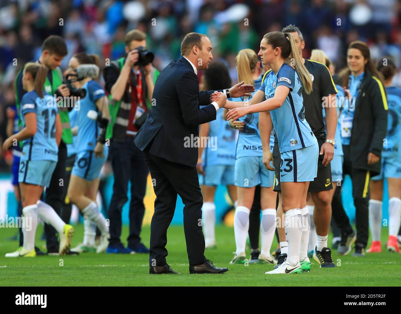 Manchester City manager Nick Cushing shakes hands with Abbie McManus after the game Stock Photo