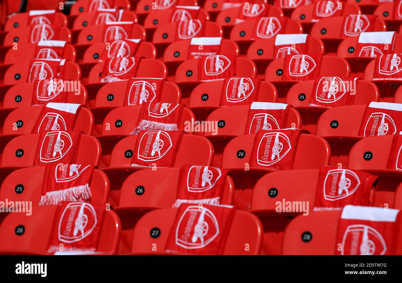 Arsenal scarves draped over seats in the stands prior to the match ...