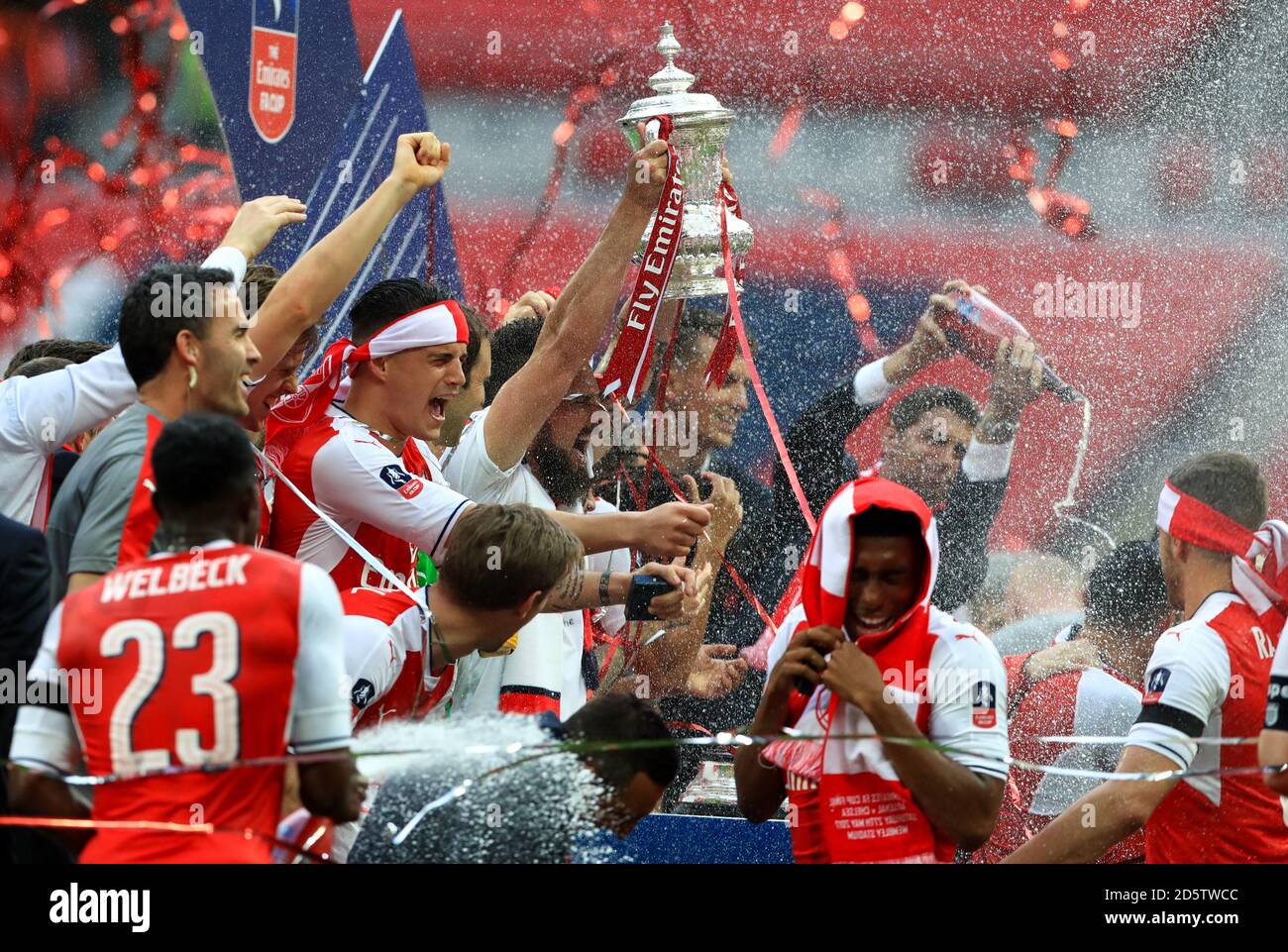 Arsenal players celebrate with the trophy after winning the FA Cup