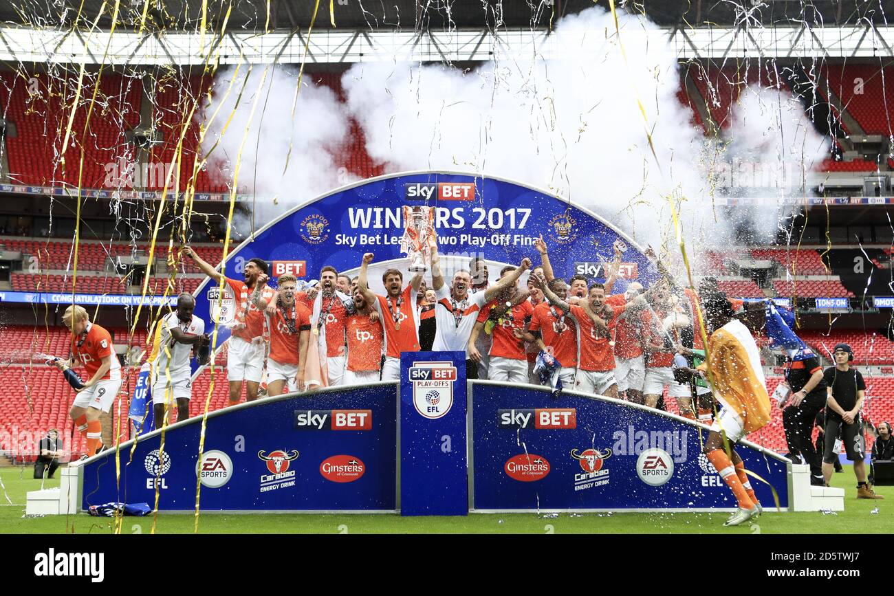 Blackpool celebrate with the trophy after the final whistle Stock Photo