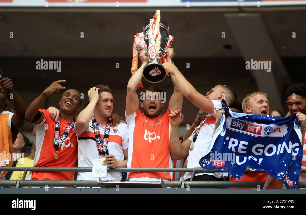 Blackpool's Andy Taylor lifts the trophy after the final whistle Stock