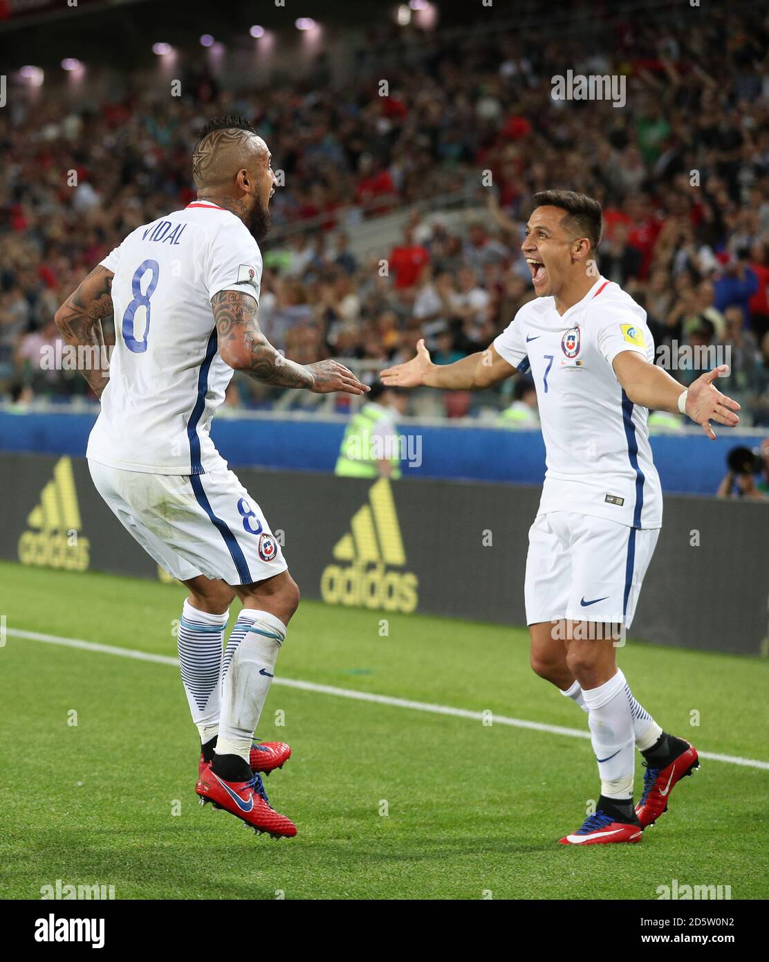 Chile's Arturo Vidal (left) celebrates scoring his side's first goal with team-mate Alexis Sanchez Stock Photo