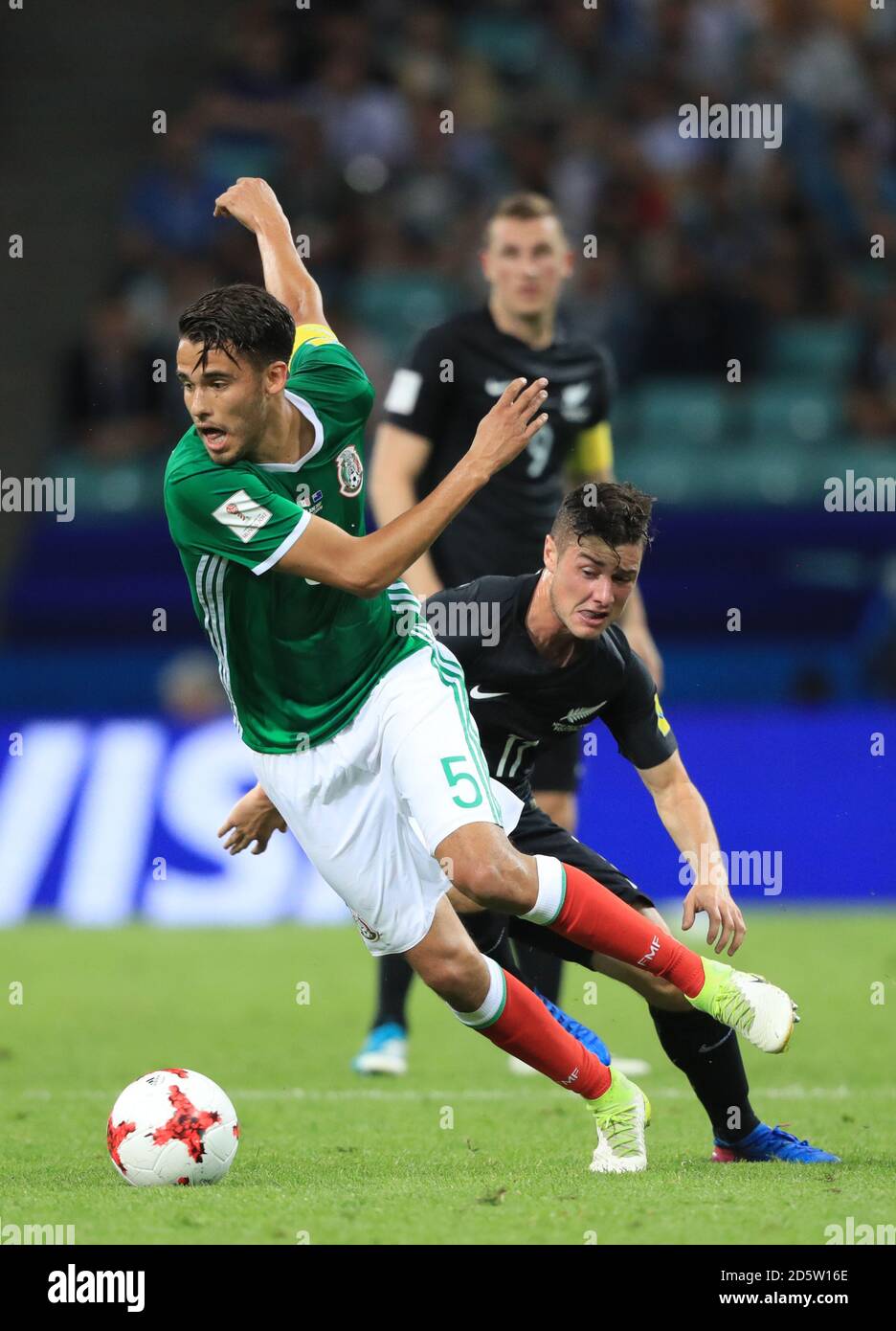 Mexico's Diego Antonio Reyes (left) and New Zealand's Marco Rojas battle for the ball  Stock Photo