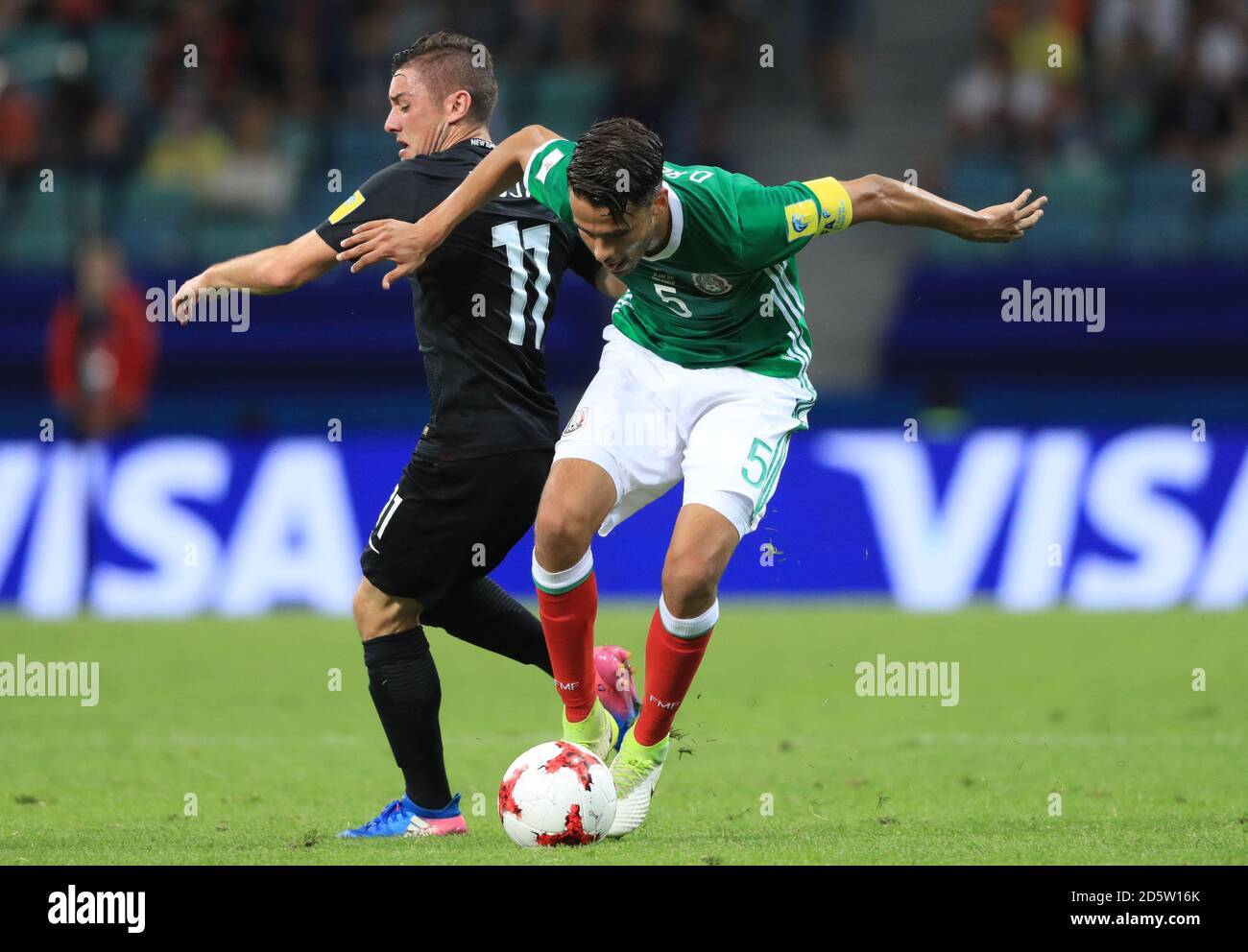 Mexico's Diego Antonio Reyes (right) and New Zealand's Marco Rojas battle for the ball  Stock Photo