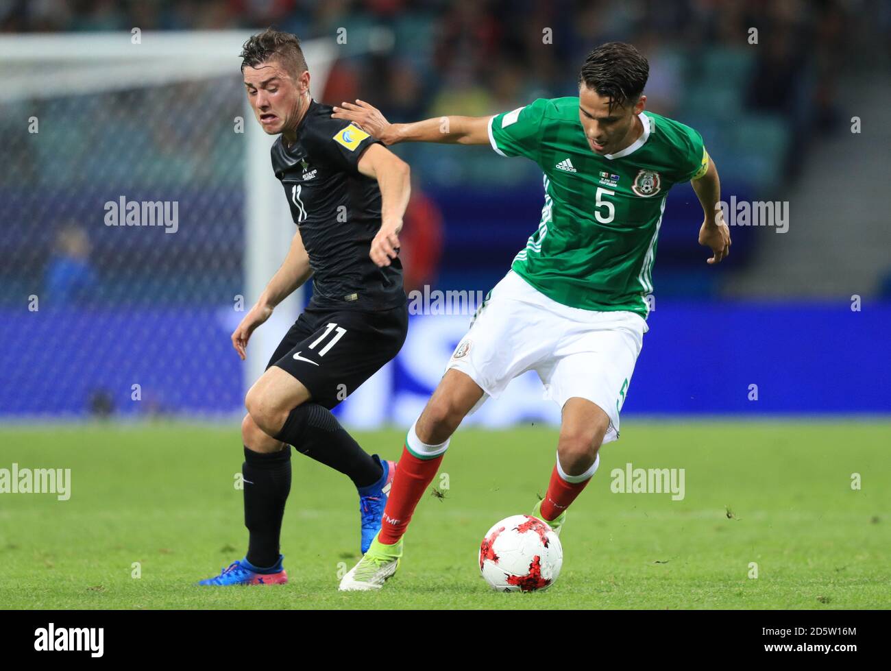 Mexico's Diego Antonio Reyes (right) and New Zealand's Marco Rojas battle for the ball  Stock Photo