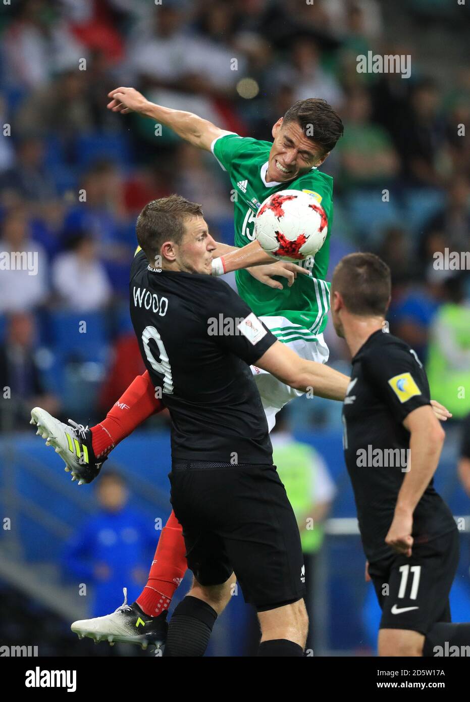 Mexico's Hector Moreno (right) and New Zealand's Chris Wood battle for the ball  Stock Photo