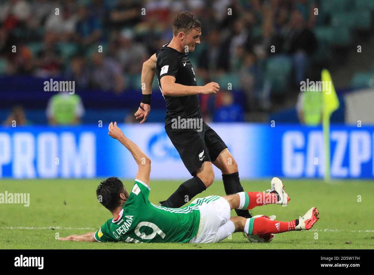 Mexico's Oribe Peralta and New Zealand's Deklan Wynne (right) battle for the ball  Stock Photo