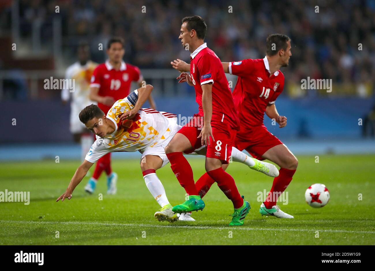 Spain's Denis Suarez (left) battles for the ball with Serbia's Nemanja Maksimovic (centre) and Vukasin Jovanovic  Stock Photo