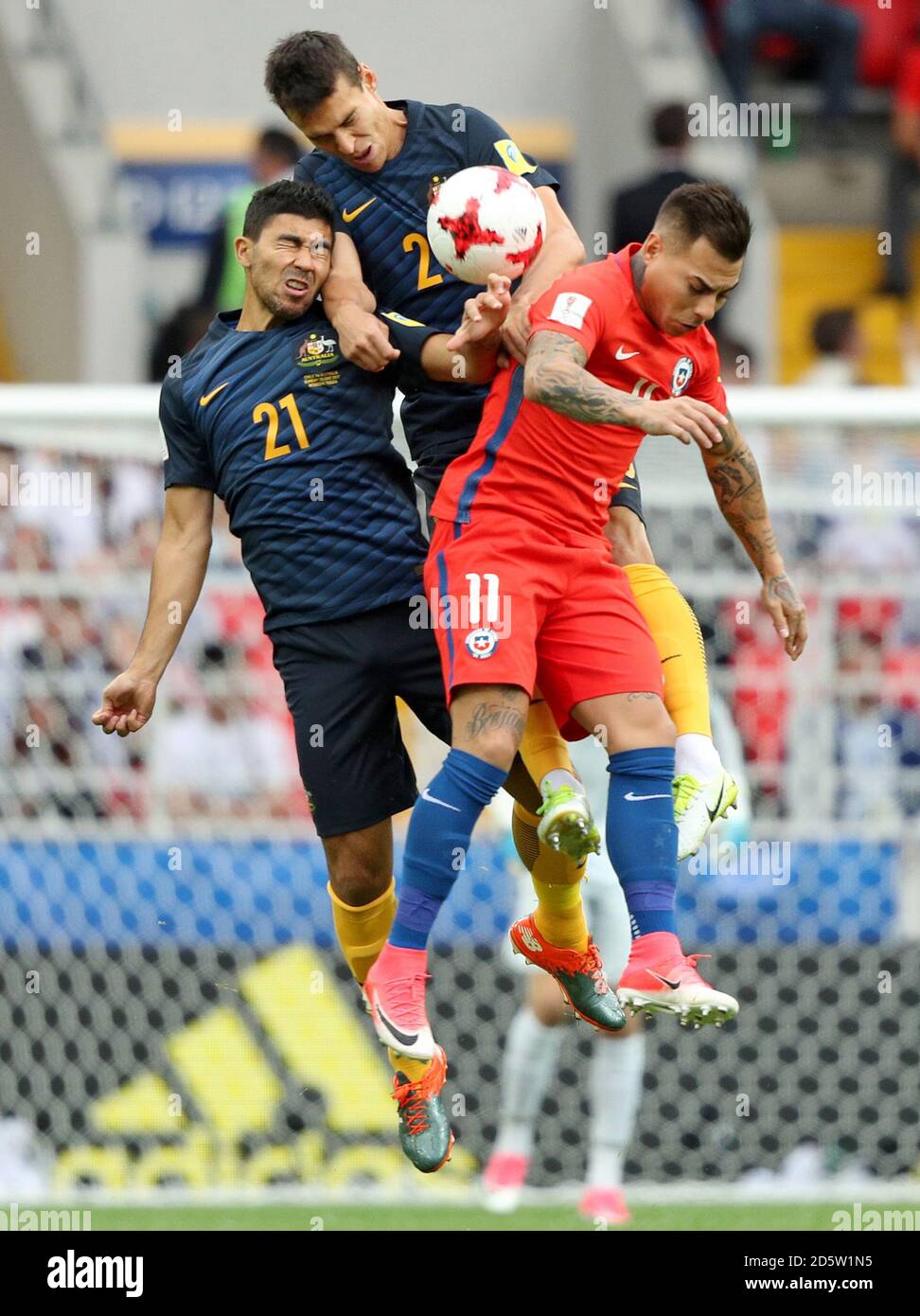 Australia's Massimo Luongo (left) and Chile's Eduardo Vargas battle for the ball (right) Stock Photo