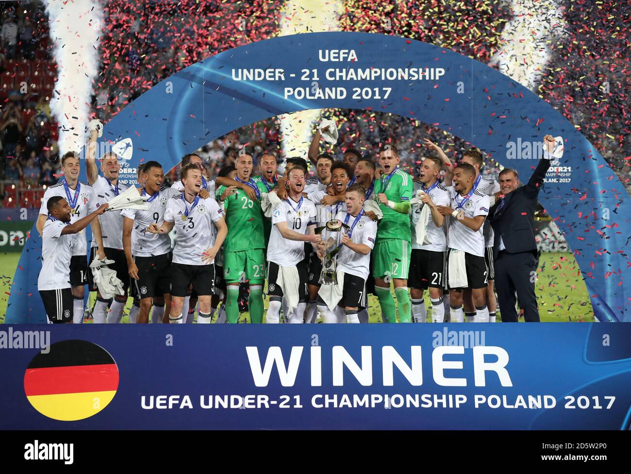 Germany's Maximilian Arnold (centre left) and Max Meyer (centre right) lift the UEFA European Under-21 Championship Trophy with teammates  Stock Photo
