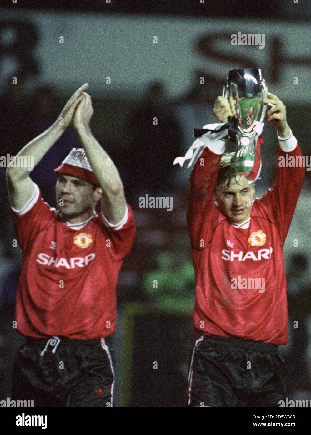 Manchester United winger Andrei Kanchelskis parades the European Super Cup at Old Trafford after they defeated Red Star Belgrade 1-0 Stock Photo