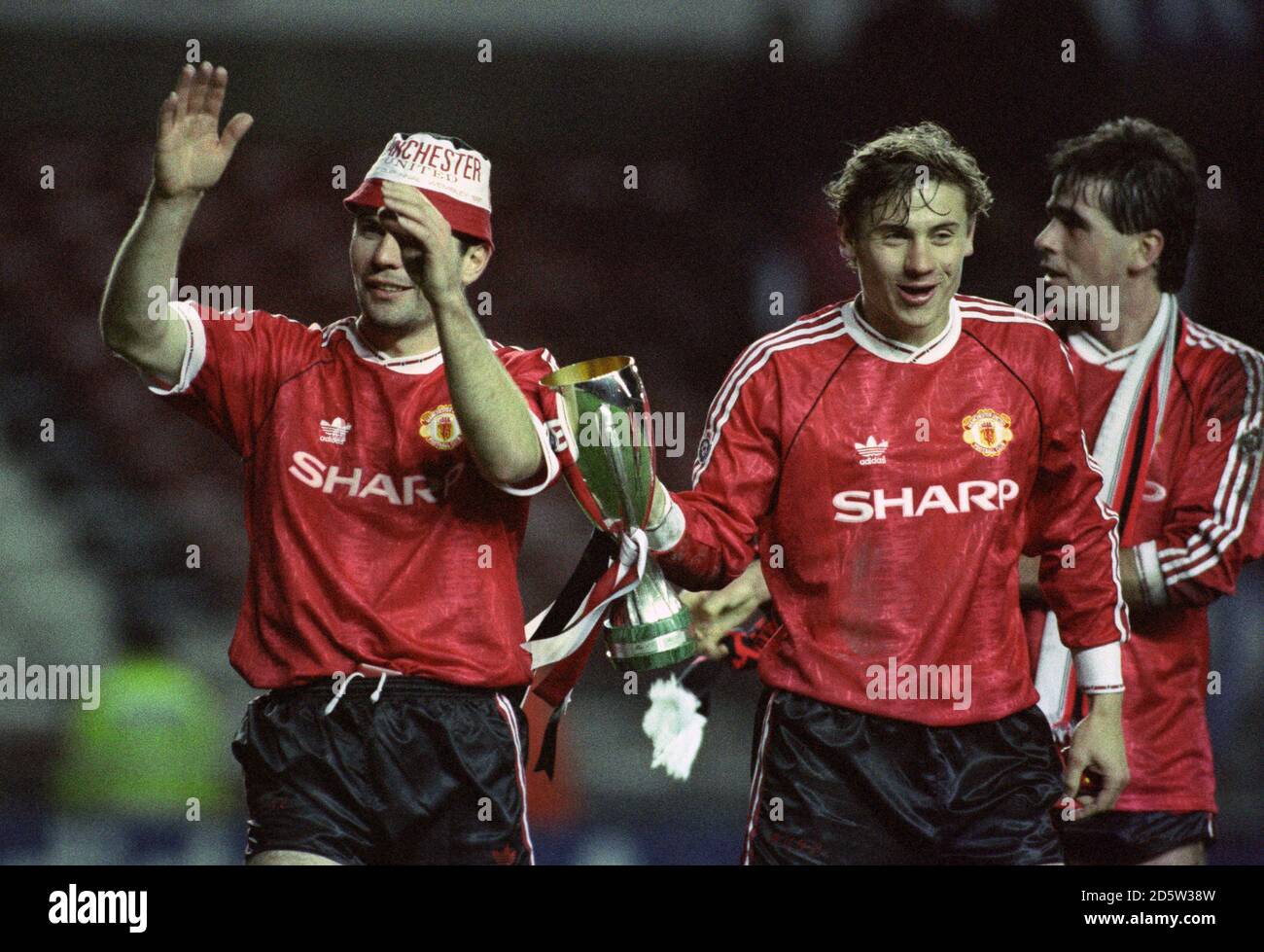 Manchester United's Andrei Kanchelskis and Brian McClair celebrate winning the European Super Cup at Old Trafford after they defeated Red Star Belgrade 1-0 Stock Photo