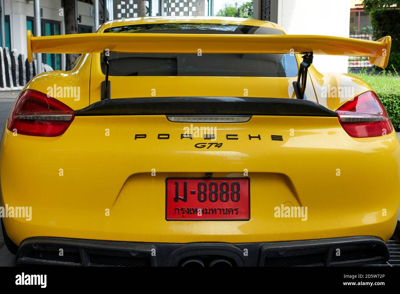 Porsche GT4 2020, 718 Cayman, yellow supercar, Thailand license plate, lucky number, 8888, Stock Photo