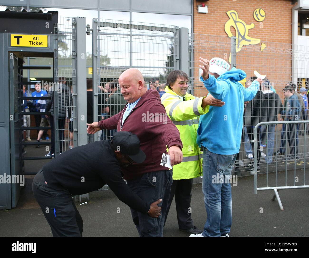 Cardiff City fans are searched as they arrive at the stadium Stock Photo