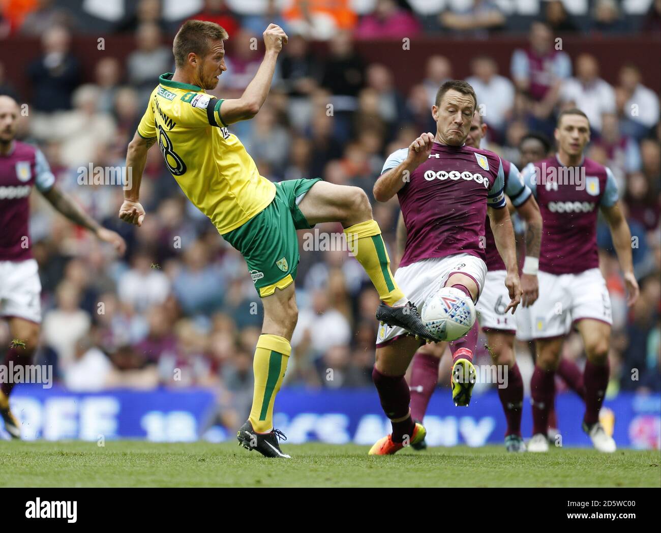 Aston Villa's John Terry and Norwich City's Marco Stiepermann battle for the ball Stock Photo