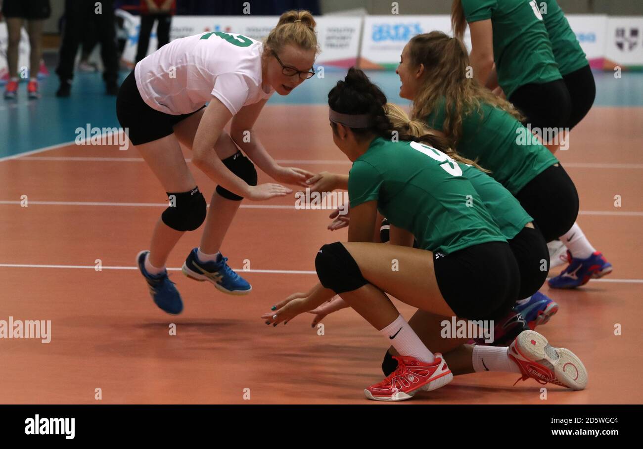 Northern Ireland's Alice Cochrane high fives her teammates prior to