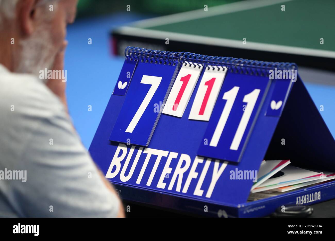 A match official checks the scoreboard during the team table tennis event during the 2017 School