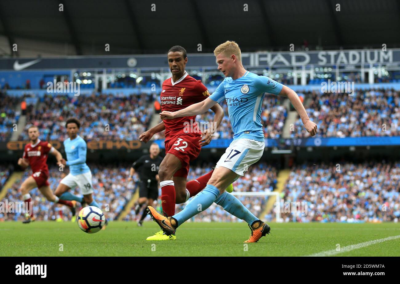 Liverpool's Joel Matip (left) and Manchester City's Kevin De Bruyne battle for the ball Stock Photo