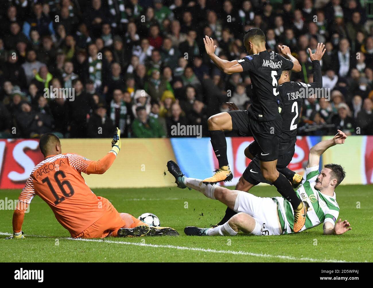 Celtic's Anthony Ralston in a collision with Paris Saint-Germain's  Alphonse Areola (left), Marquinhos (front) and Thiago Silva (back) Stock Photo