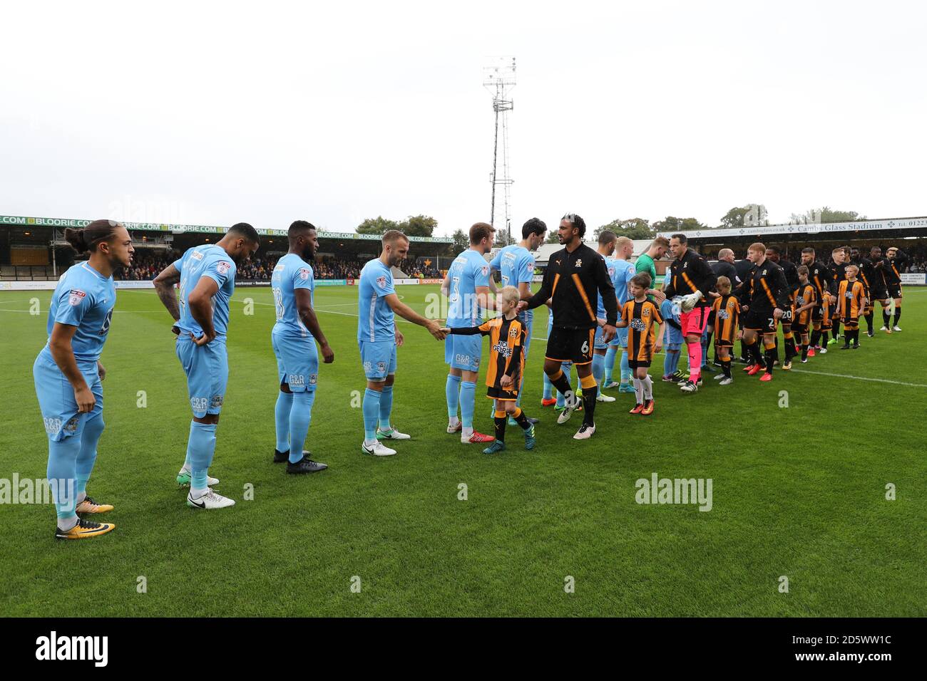Coventry City and Cambridge United players shake hands before the game  Stock Photo