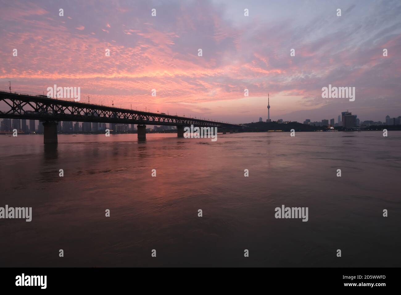 sunset of Wuhan Yangtze River Bridge. landmark of Wuhan,Hubei,China. Beautiful sunset clouds in sky Stock Photo