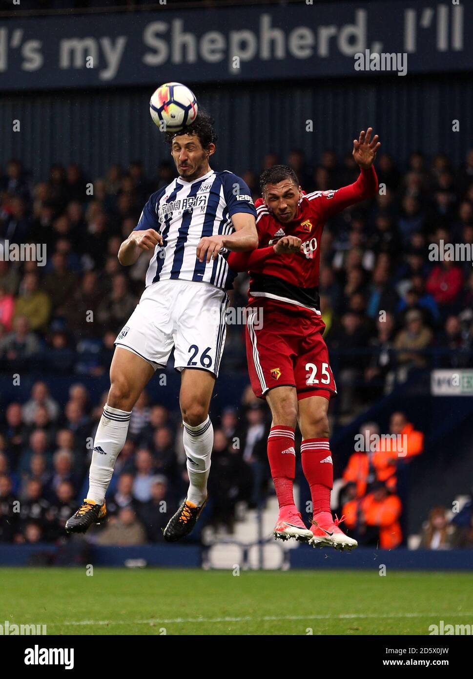 West Bromwich Albion's Ahmed Hegazy and Watford's Jose Holebas jump for a header Stock Photo