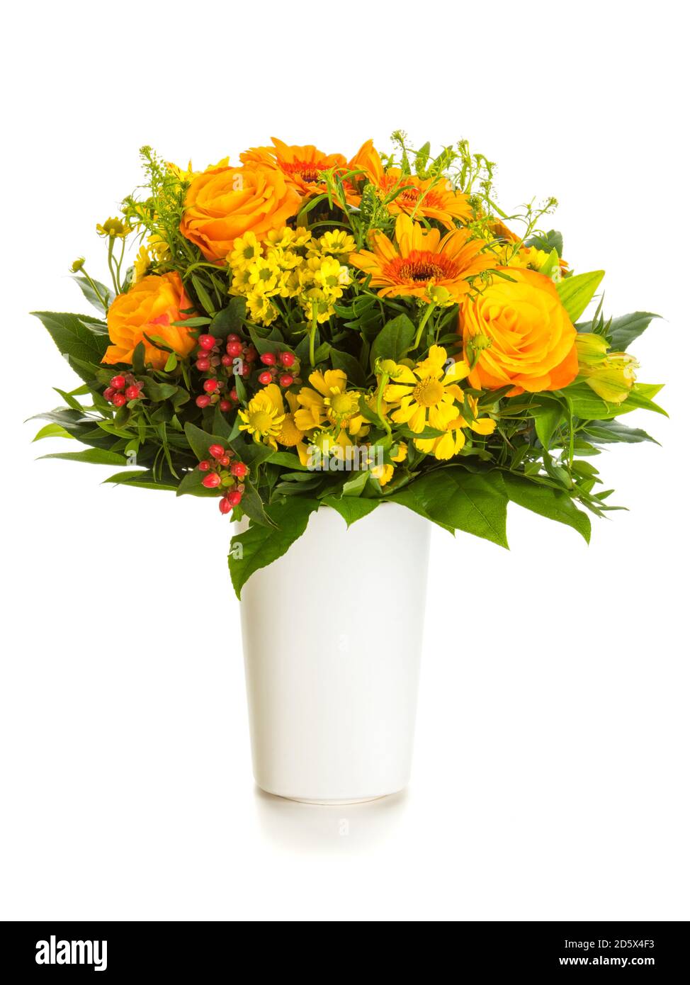 Autumnal flowers bouquet with yellow and orange helenium, rose and gerber blossoms and myrtles in vase isolated on white background Stock Photo