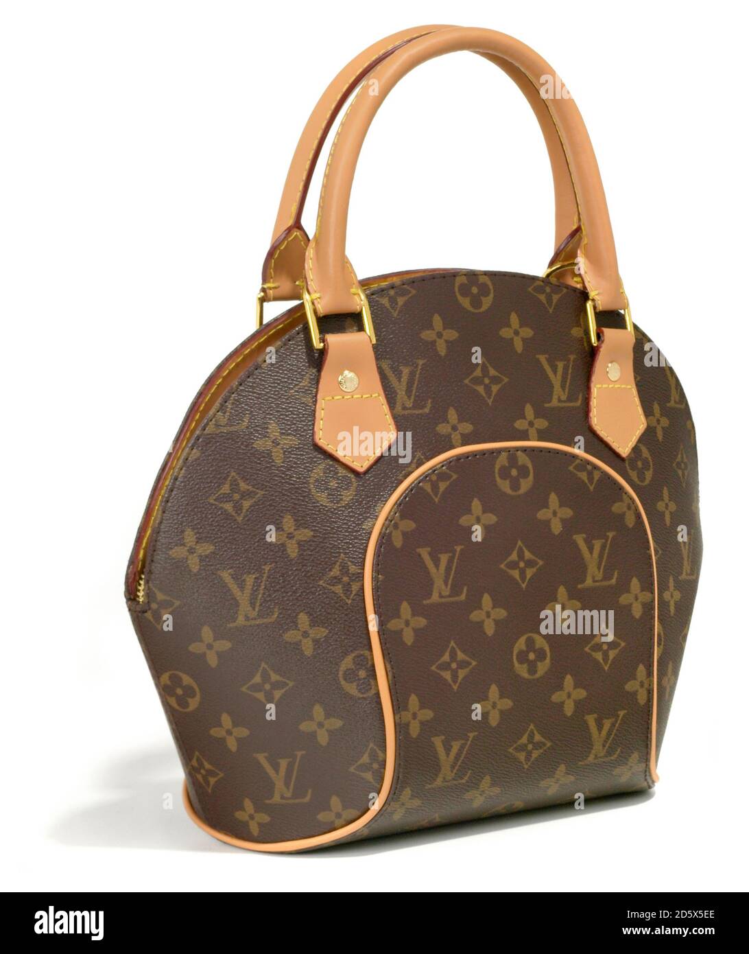 Louis Vuitton monogrammed bowling vanity canvas handbag with leather trim and handles photographed on a white background Stock Photo