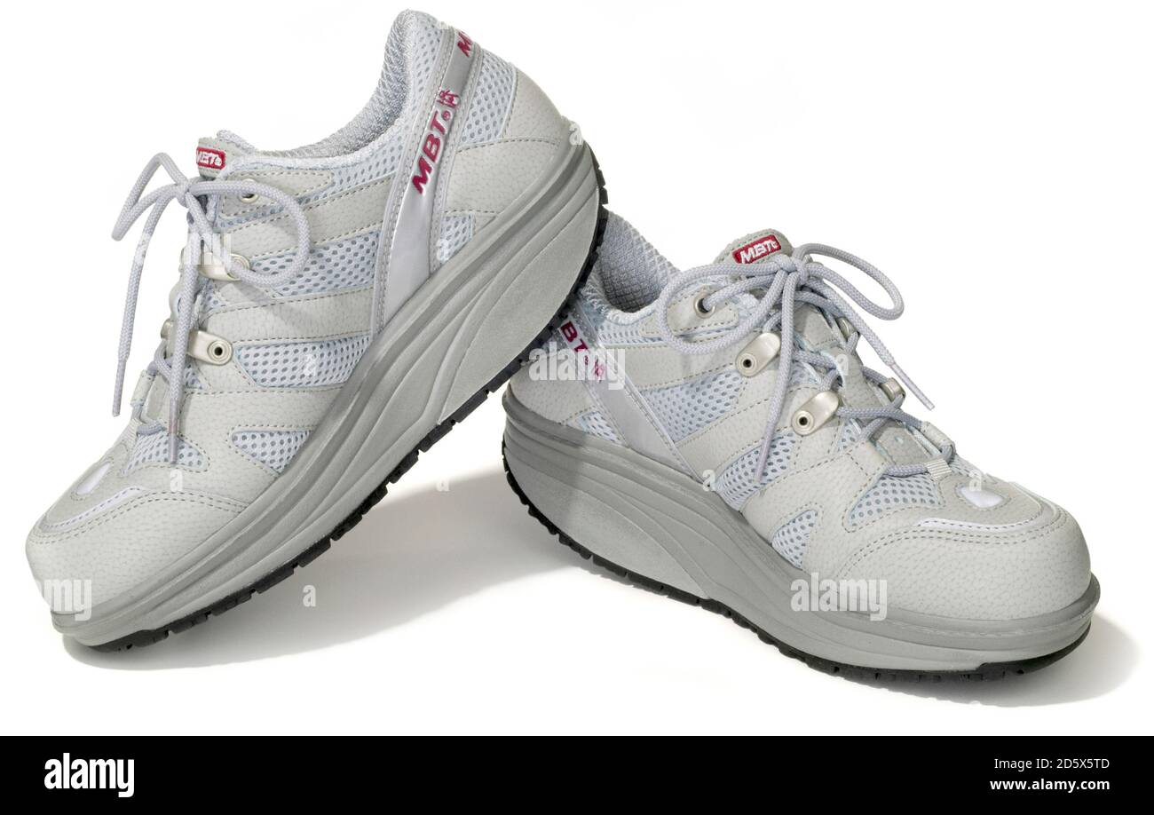 Pair of MBT grey sneakers photographed on a white background Stock Photo