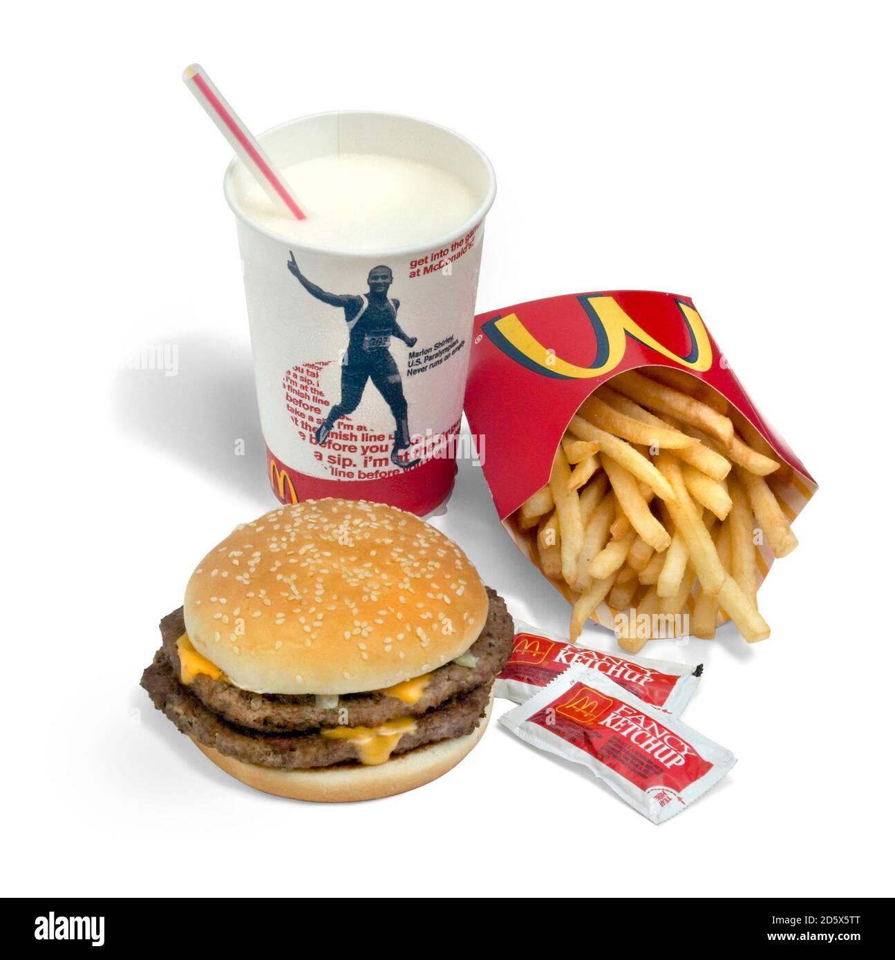 McDonald's value meal including a double cheeseburger, vanilla milkshake, and french fries photographed on a white background Stock Photo
